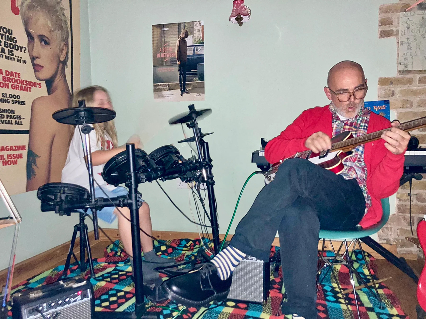 Sam Knee playing with his son